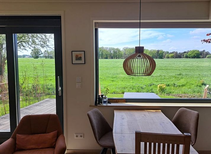 Vacation cottage in Lippenhuizen offers a beautiful view of the green Frisian forests in Friesland.