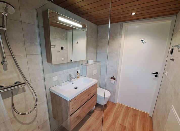 Indoor area of Holiday Home in Lippenhuizen overlooking the green fields of Friesland.