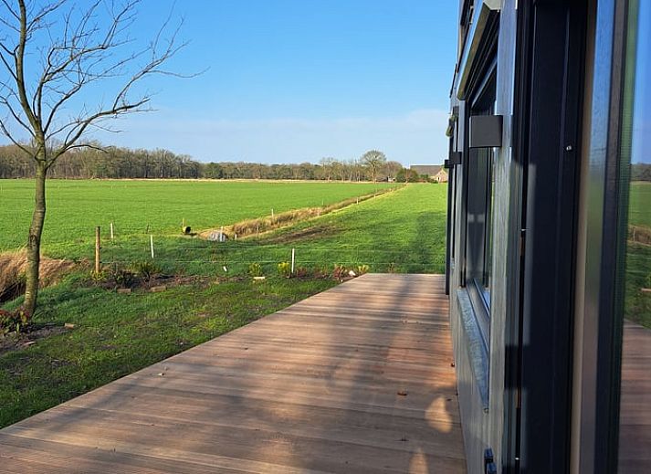 Indoor area of Holiday Home in Lippenhuizen overlooking the green fields of Friesland.
