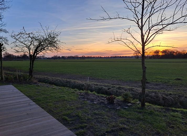Indoor area of Holiday Home in Lippenhuizen overlooking the green fields of Friesland.