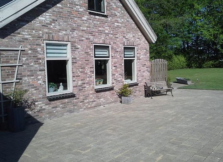 Brick facade of Holiday home in Steggerda, surrounded by Frisian forests in Friesland.