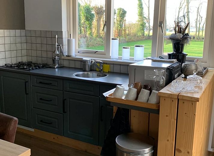Brick facade of Holiday home in Steggerda, surrounded by Frisian forests in Friesland.