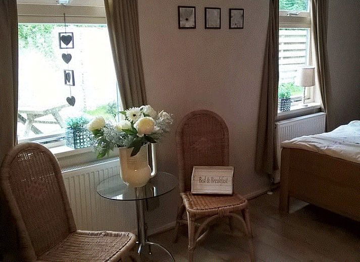 Entrance with wooden bench at Holiday Home in Steggerda, located in Friesland.