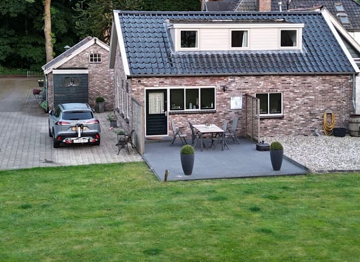 Cozy living room in Holiday home in Steggerda, surrounded by Frisian nature.