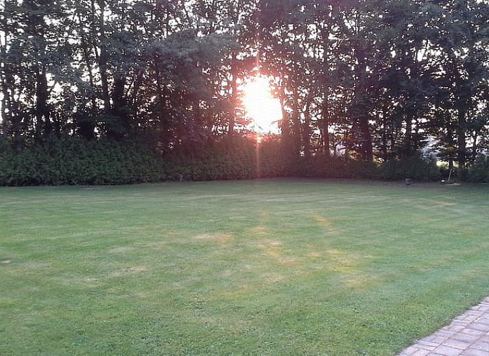 Dining room with wooden table in Holiday home in Steggerda, in the middle of the Frisian forests.