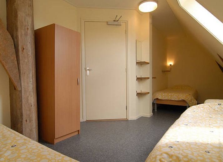 Spacious kitchen in vacation home at Recreatiebedrijf de Blikvaart, Sint Annaparochie, ideal for group stays in Friesland.