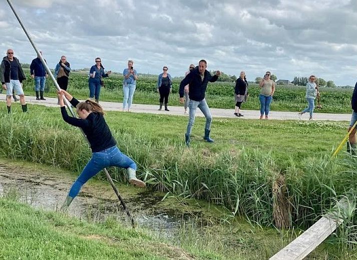 Bright living room with table soccer at Recreatiebedrijf de Blikvaart, Sint Annaparochie, offers relaxation in the Frisian countryside.
