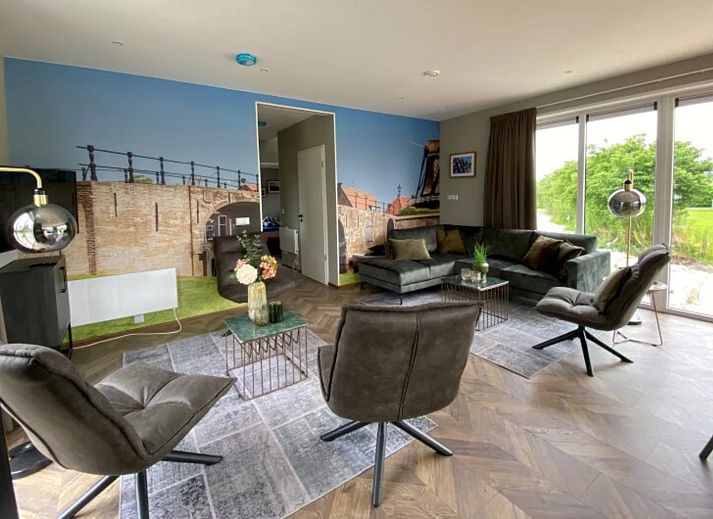 Detached house in Hindeloopen, a vacation home in the Frisian Eleven Cities of Friesland, surrounded by green nature and blue skies.