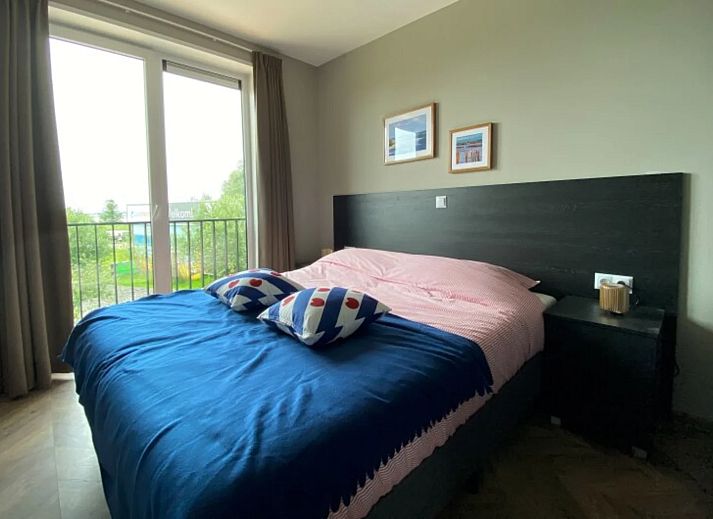 Stylish living room in the detached house in Hindeloopen, Friesland, with modern interior and views of green surroundings.