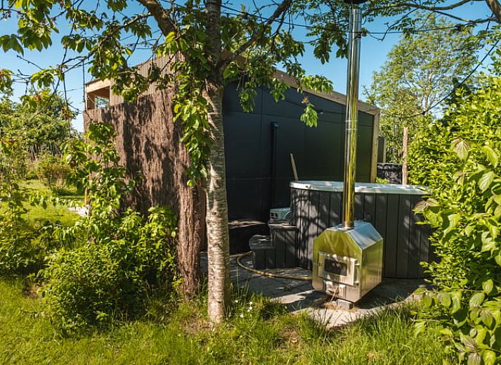 Private hot tub at Holiday home in Scherpenzeel, ideal for relaxation in Friesland.