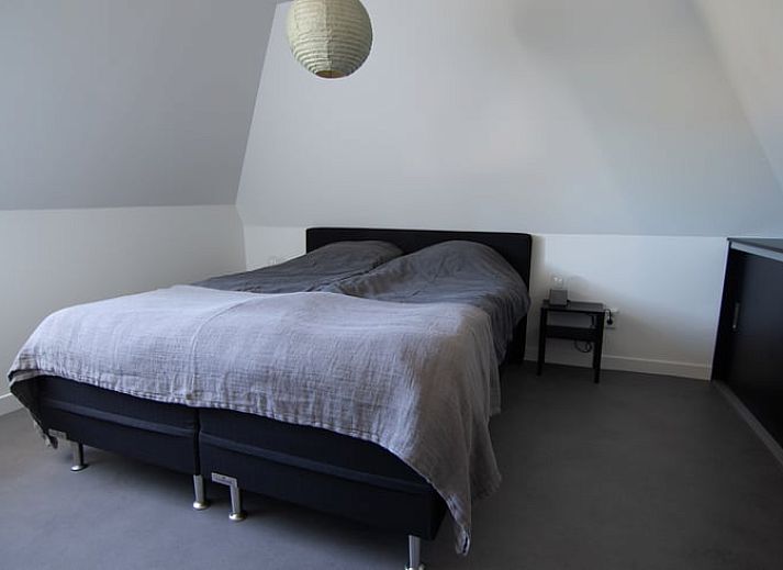 Cottage in Paesens, cozy living room with wood stove in the Frisian countryside.