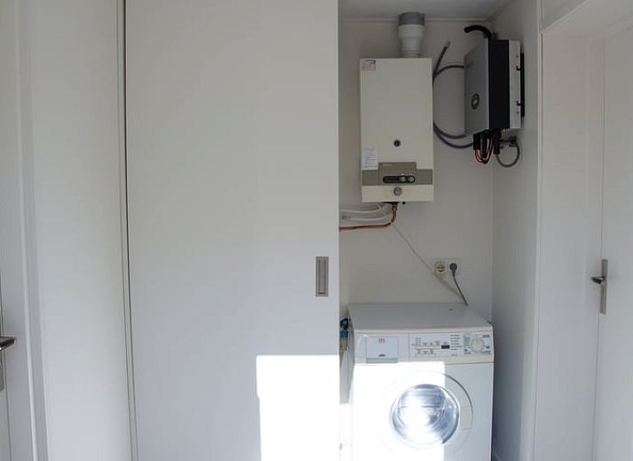 Cottage in Paesens, cozy sitting area with wood stove in Friesland.