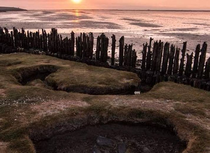 Cottage in Paesens, cozy sitting area with wood stove in Friesland.