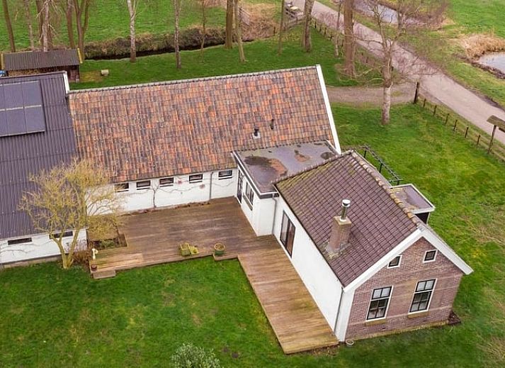 Enjoy wine on the terrace of Holiday Home in Bantega, Friesland, overlooking nature.