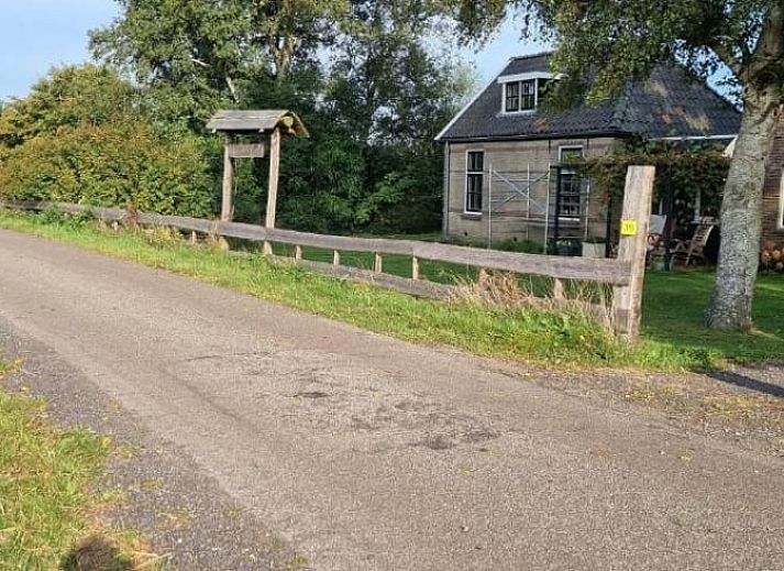 Enjoy wine on the terrace of Holiday Home in Bantega, Friesland, overlooking nature.