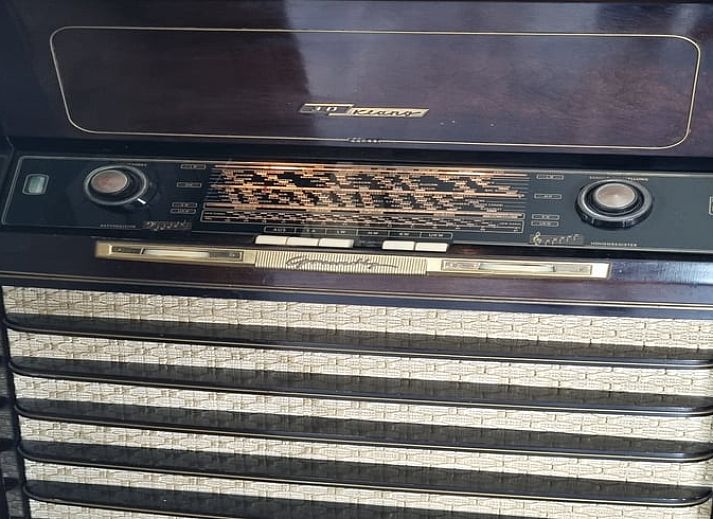 Comfortable chairs in the garden of Holiday Home in Bantega, Friesland, overlooking green meadows.