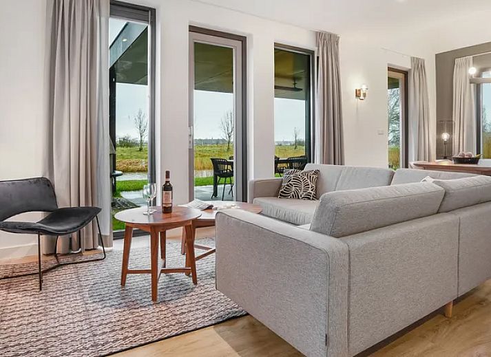 6-persoons woning 6C in Witmarsum, Friesland, met houten gevel op het Friese platteland.