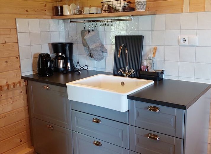 Entrance to Cottage in Munnekeburen with cozy porch and chairs.
