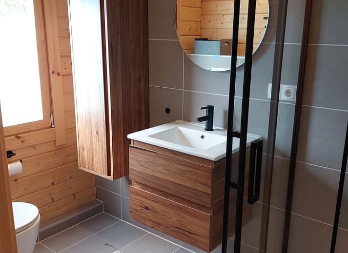 Entrance to Cottage in Munnekeburen with cozy porch and chairs.