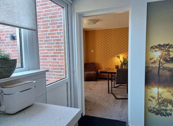 Modern kitchen of vacation home FR440 in Surhuisterveen overlooking the terrace.