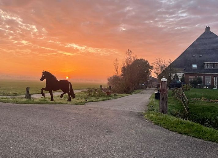 Breathtaking sunset at Cottage in Goenga, located in the Frisian countryside in Friesland.