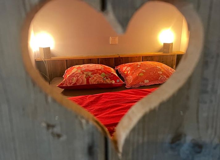 Atmospheric view of Cottage in Goenga with a horse silhouette at sunrise in Friesland.