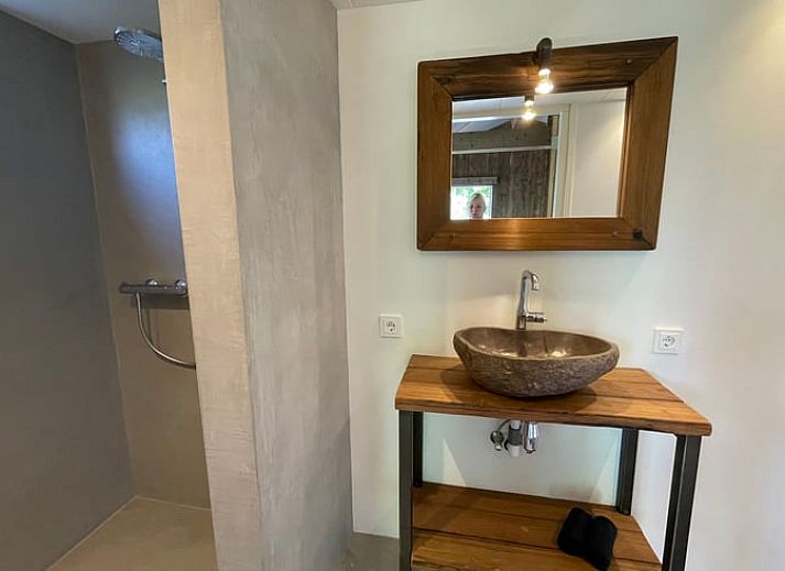 Cozy living room of vacation home Cottage in Goenga overlooking the Frisian countryside.