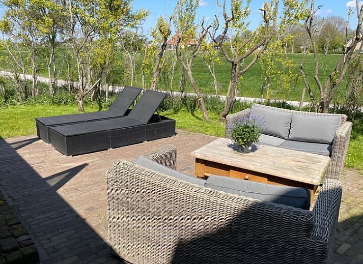 Cozy living room of vacation home Cottage in Goenga overlooking the Frisian countryside.