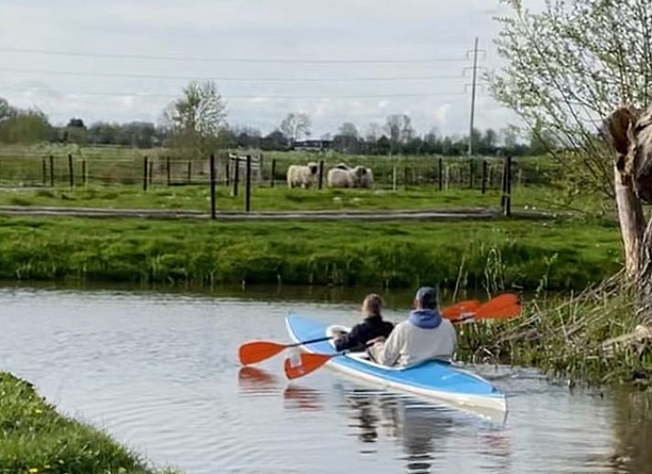 Rustic interior of Cottage in Goenga with wooden accents and views of nature.