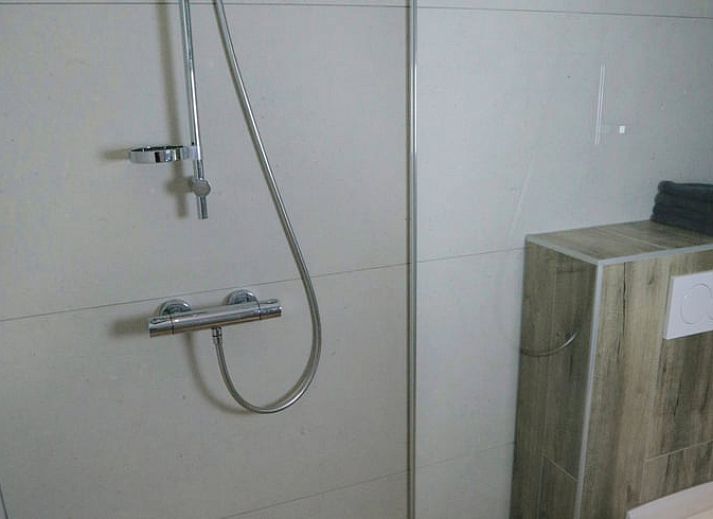 Gezellige zithoek in Huisje in Bornwird, vakantieaccommodatie op het Friese platteland.