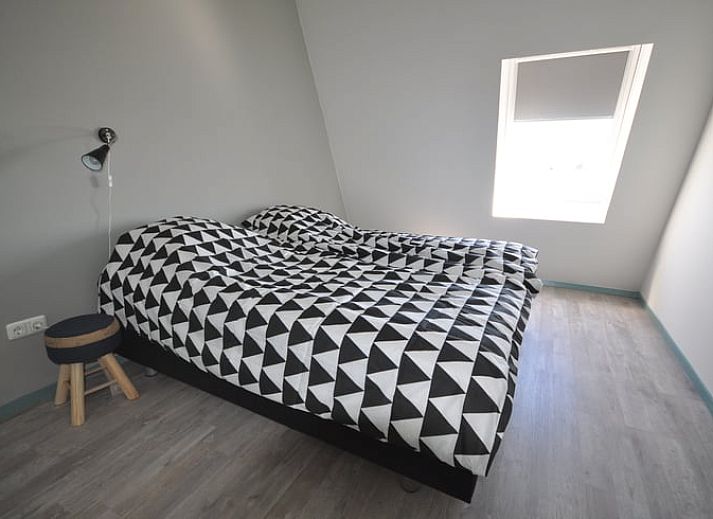 Sunny reading corner overlooking the garden at Cottage in Jannum near Dokkum, Friesland.