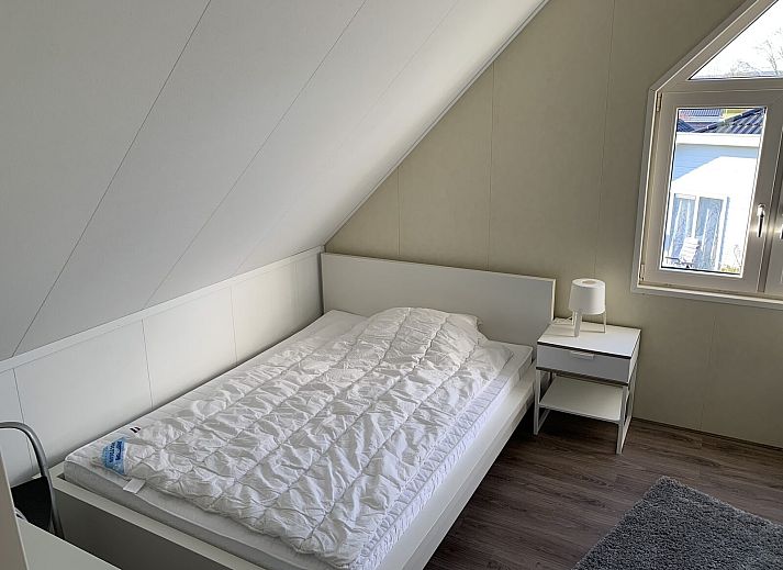 Zand Lodge in Lathum, Gelderland showcases a stylish exterior with modern architecture, perfect for a vacation in the River Region.