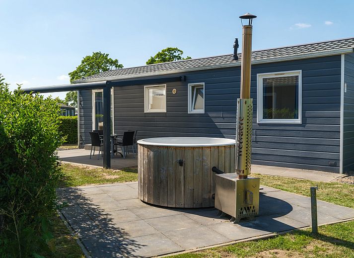 Gezellige Veluwe Lodge in Lathum met terras en moderne afwerking, ideaal voor een ontspannen vakantie in het Rivierengebied.