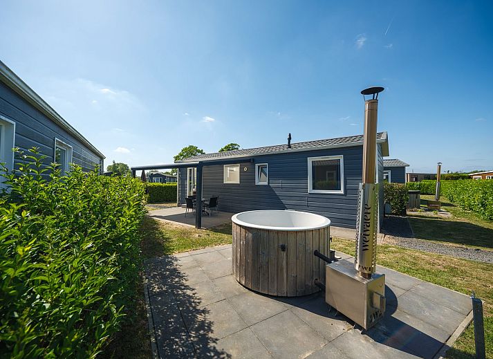 Gezellige Veluwe Lodge in Lathum met terras en moderne afwerking, ideaal voor een ontspannen vakantie in het Rivierengebied.