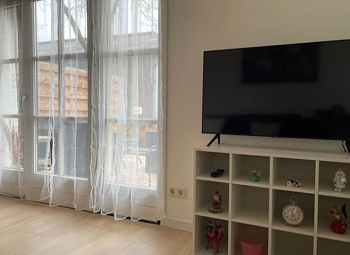 Charmante buitenkant van Vakantiehuisje in Tricht, Gelderland, met uitnodigend terras.
