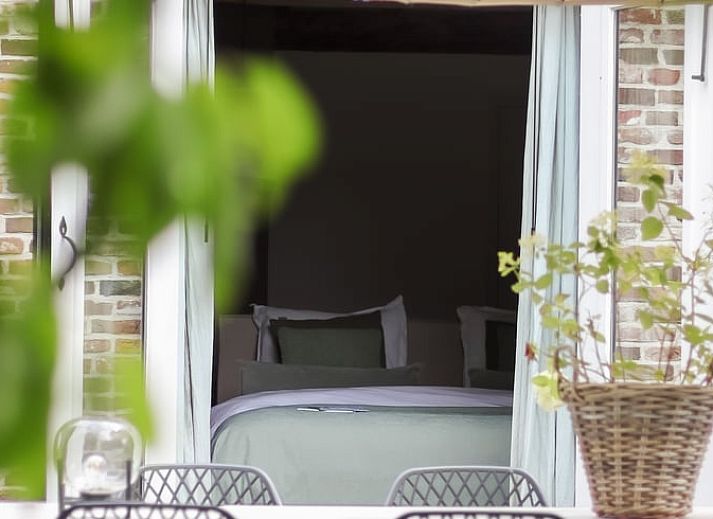 Attractive bathroom in Holiday Home in Altforst, Gelderland, with freestanding bathtub and rustic wooden elements for a relaxing stay.