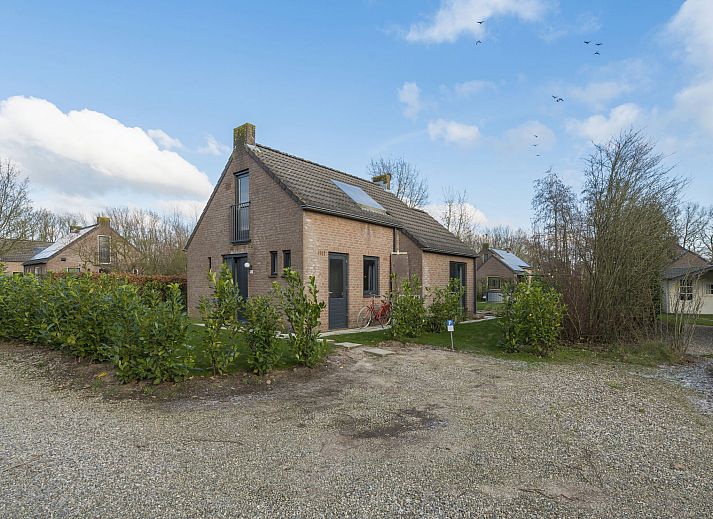 Cozy attic room in Holiday Home Vip Wellness Ewijk, Ewijk, Gelderland with sloping skylights and rustic atmosphere.