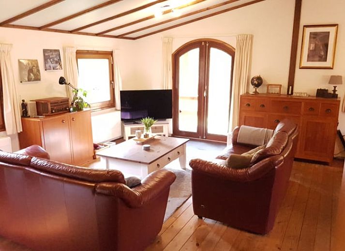 Covered veranda of vacation home in Wolfheze, ideal for relaxing moments in Gelderland.