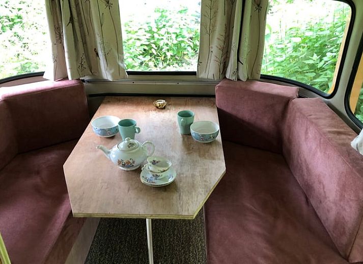 Vacation home in Dreumel, Gelderland, offers a charming caravan experience amid green nature and rustic surroundings.