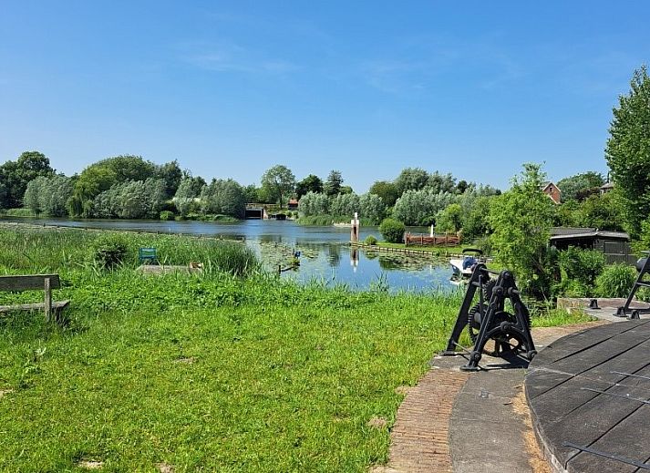 Cozy indoor area of Betuwsend in Acquoy, Gelderland, with sitting area and access to terrace for a relaxing stay.