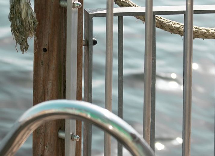 Spacious waterfront terrace at Cottage in Maasbommel, perfect for enjoying nature.