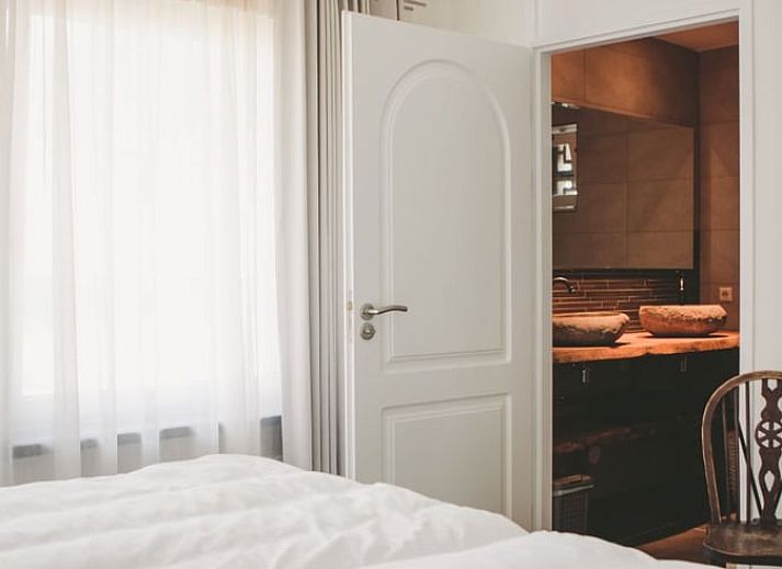 Gemuetliches Wohnzimmer im Ferienhaus in Rossum, ideal fuer Entspannung in Gelderland.