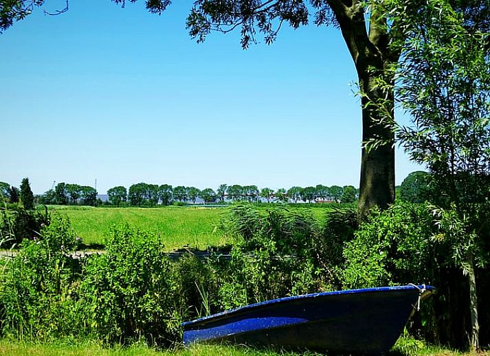 Gemuetliches Wohnzimmer im Ferienhaus in Rossum, ideal fuer Entspannung in Gelderland.