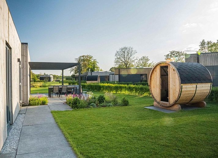 Enjoy the sunny veranda of Holiday Villa Amalia 6 with sauna in Kotten, Achterhoek, Gelderland.