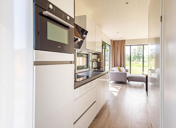 Enjoy the sunny veranda of Holiday Villa Amalia 6 with sauna in Kotten, Achterhoek, Gelderland.