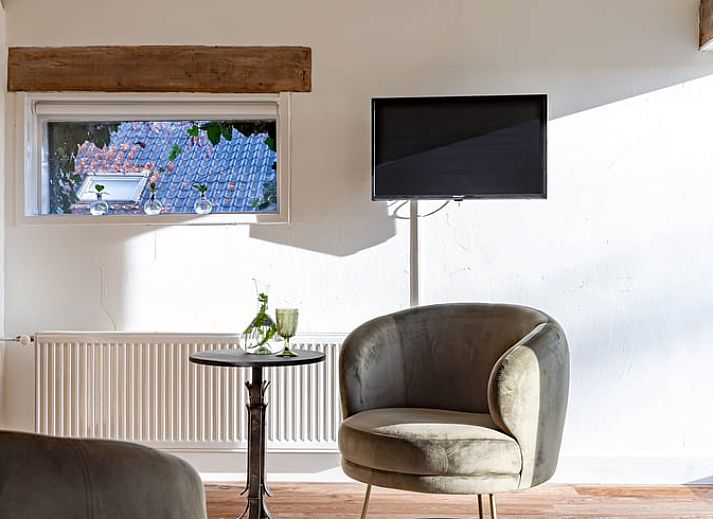 Fitness room in Huisje in Halle, a vacation home in the Achterhoek region of Gelderland, with modern equipment for an active vacation.