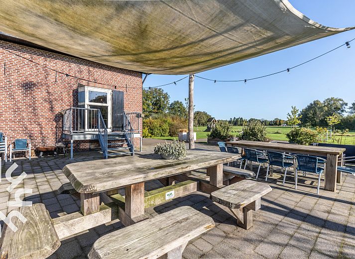 Stylish dining room in vacation home DG303, Halle, Achterhoek, with wooden interior