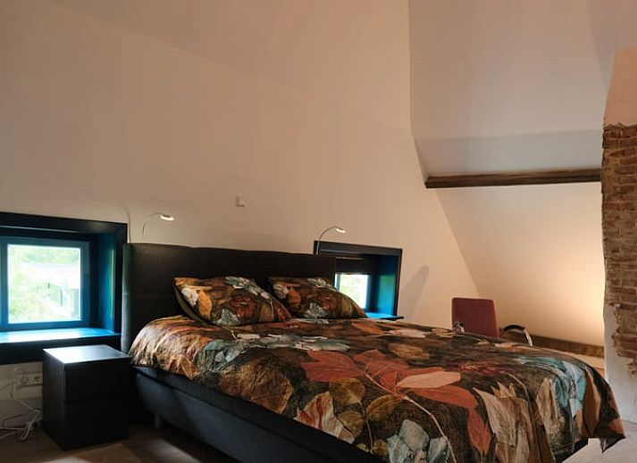 Gemuetliches Wohnzimmer des Ferienhauses in Zelhem, Achterhoek, Gelderland mit modernen Moebeln und Holzofen fuer eine gemuetliche Atmosphaere.