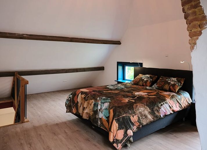 Gemuetliches Wohnzimmer des Ferienhauses in Zelhem, Achterhoek, Gelderland mit modernen Moebeln und Holzofen fuer eine gemuetliche Atmosphaere.