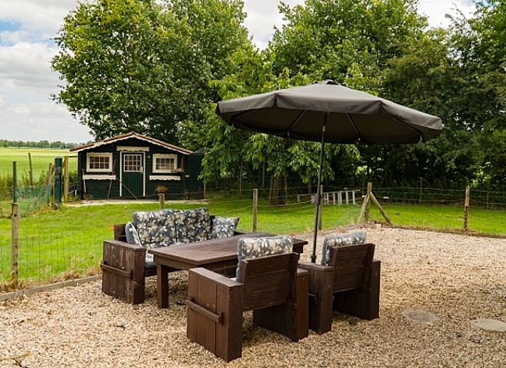 Das Ferienhaus in Ruurlo, in der schoenen Region Achterhoek gelegen, bietet einen idyllischen Blick auf den bluehenden Garten und die Natur Gelderlands.